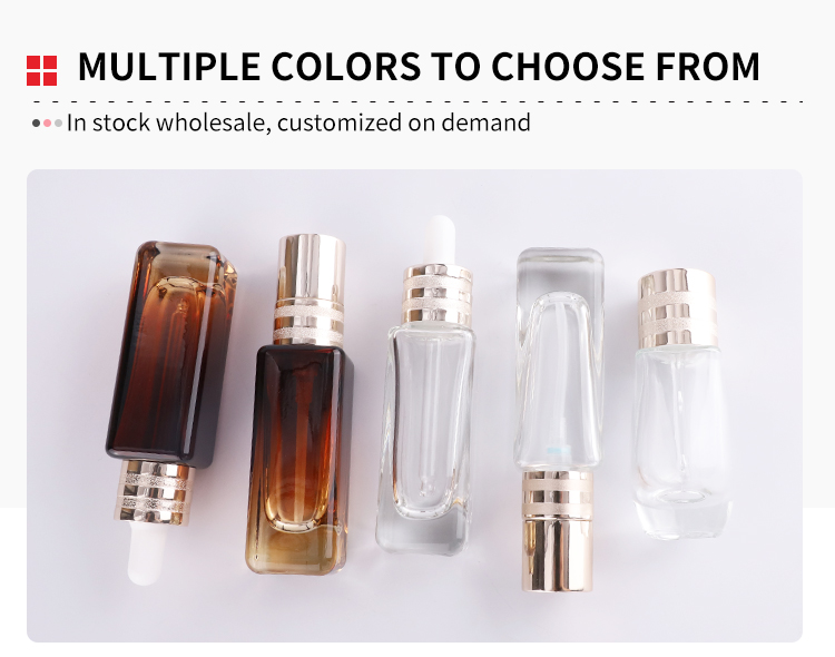 Wholesale glass bottle with gold dropper 
