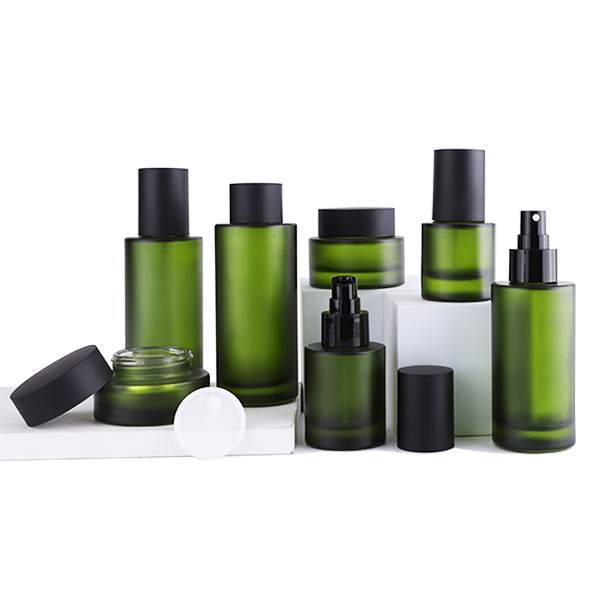Wholesale new design frosted green cosmetic glass bottle set 