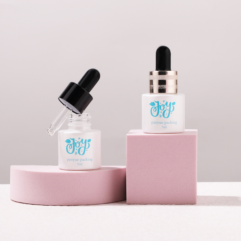 white essential oil bottle with dropper
