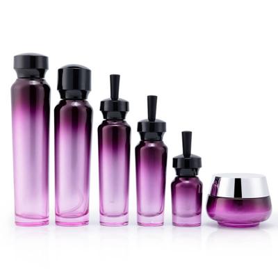 Empty purple glass bottle set