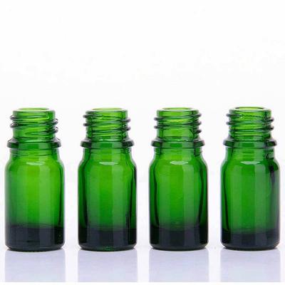 Green glass beauty essential oil bottle