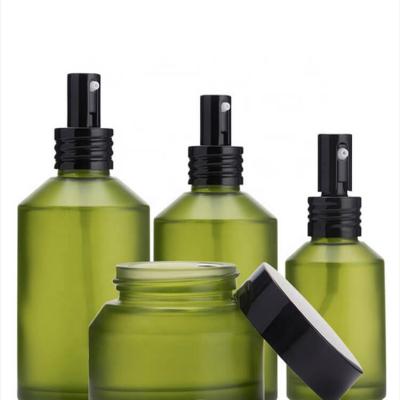 green cosmetic glass bottle