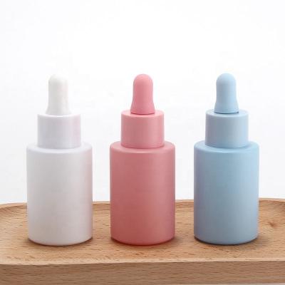 pink blue white face serum oil dropper bottle