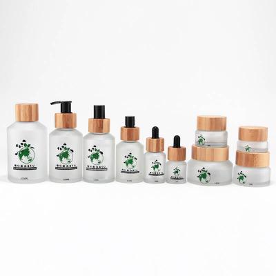Frosted clear cosmetic glass bottle set with bamboo lid