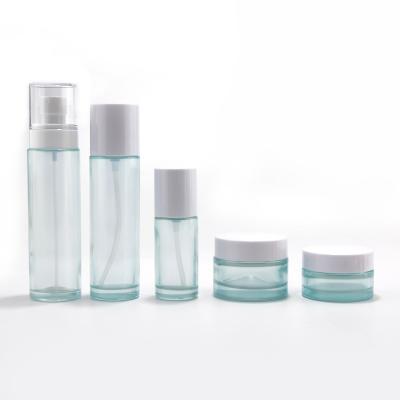 Custom color cosmetic glass bottle and glass jar for packaging