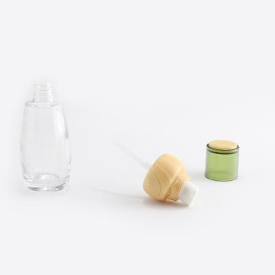 Clear cosmetic glass bottle set with bamboo lid