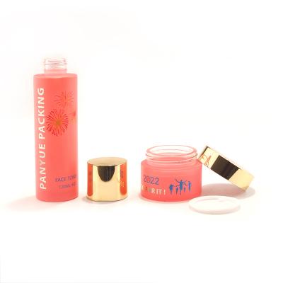 Flat shoulder cosmetic glass bottle set with logo printing
