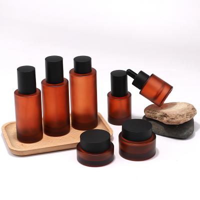 Amber flat shoulder glass bottle with lotion pump for packaging