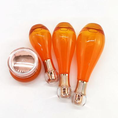 Orange cosmetic glass bottle jar