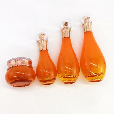 Bowling ball shaped orange glass bottle jar