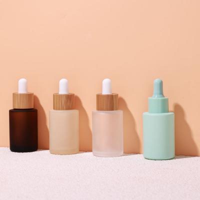 Flat shoulder round bamboo dropper bottle