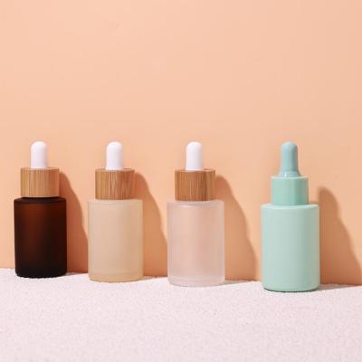 Empty matte cosmetic glass bottle with bamboo dropper