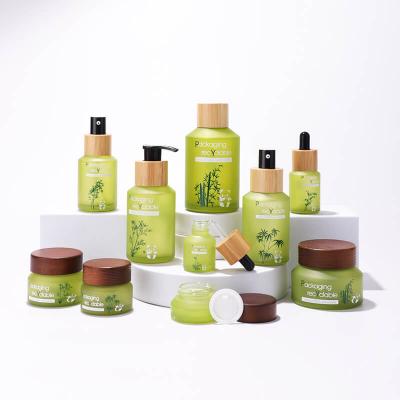 Cosmetic slanted shoulder green glass bottle set packing