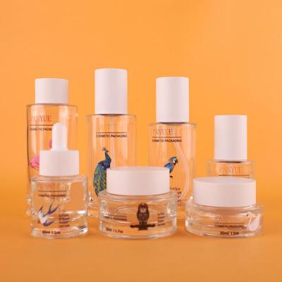 High quality flat shoulder cosmetic glass bottle set in skincare for cosmetic packaging