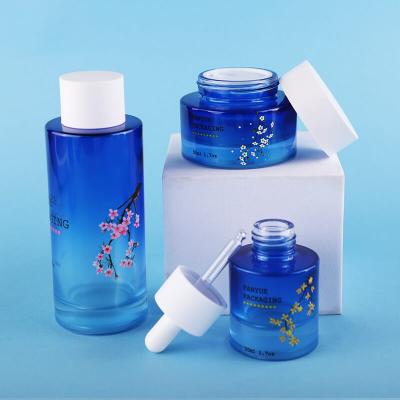 High Quality Gradient Blue Flat Shoulder Glass Bottle Set Packing
