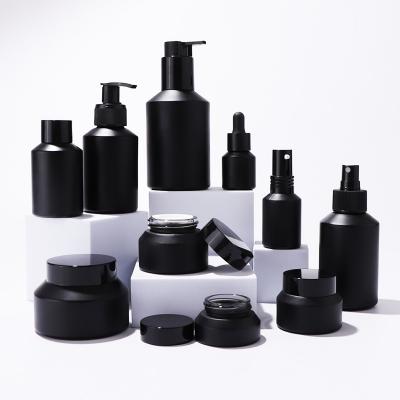 Black matte glass bottles and jars for skin care packaging