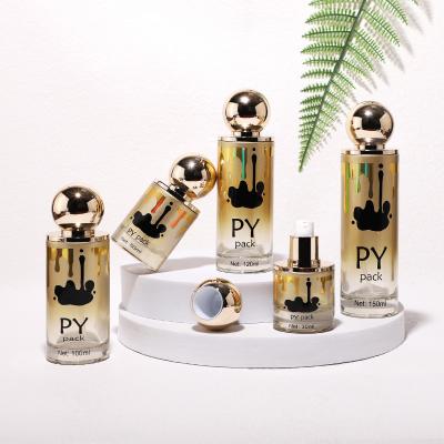 Gold cosmetic glass bottle set with aluminum Spherical lid