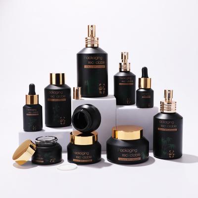 Black slanted shoulder glass bottle set for cosmetic packaging skincare