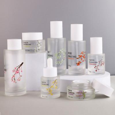 Printed flat shoulder glass bottle set