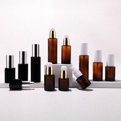 Flat shoulder glass oil bottle