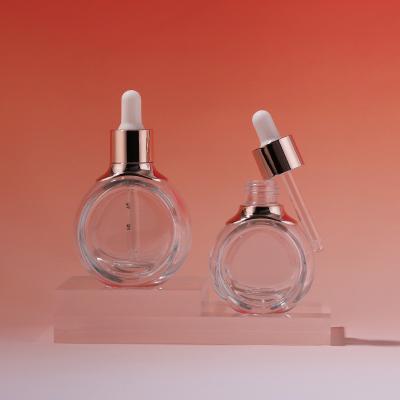 Transparent flat circular shape glass dropper coesmetic bottle