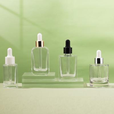 Clear glass essence dropper bottles can be customized with square round shape